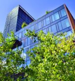 Sustainable,Glass,Office,Building,With,Trees,For,Reducing,Carbon,Dioxide.