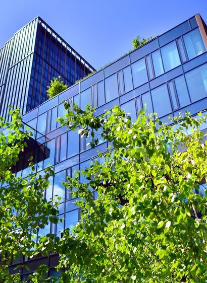 Sustainable,Glass,Office,Building,With,Trees,For,Reducing,Carbon,Dioxide.